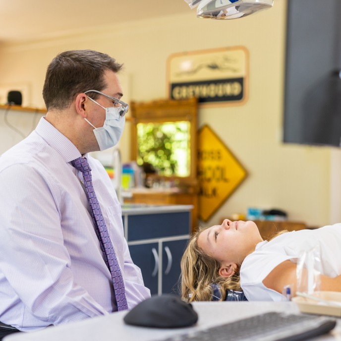 Dr. Hulme and a patient discuss treatment at our Boerne, TX office.