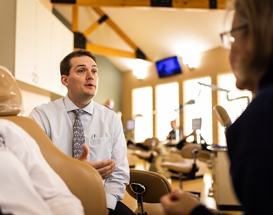 Dr. Hulme talks to a patient in San Antonio (Huebner Park), TX