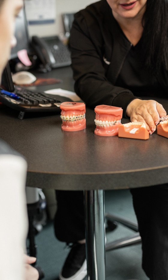 The treatment coordinator at Hulme Orthodontics discusses treatment options with a patient.